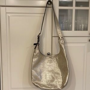 Gold coach bag. Still has original tag, gold leather coach hobo bag
